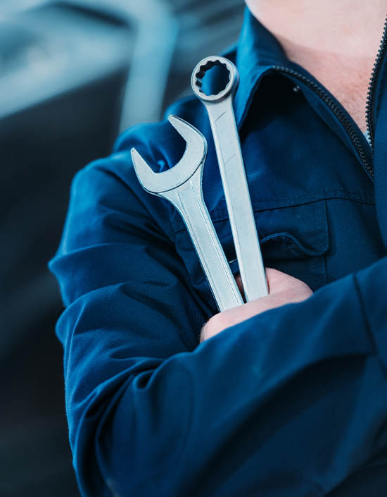 technician holding tools